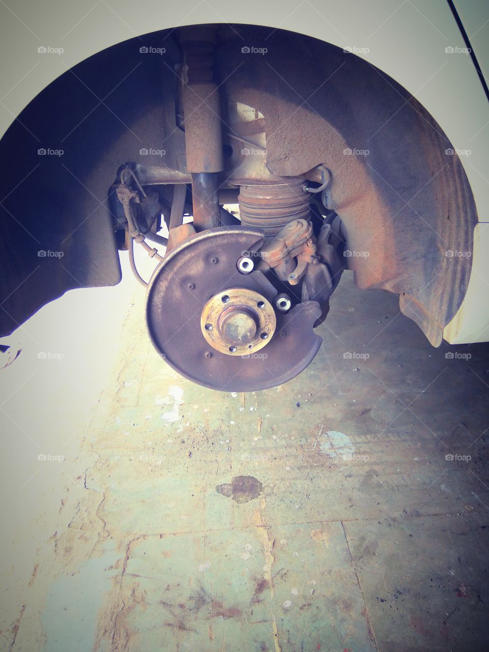 Audi brake pad replacement. Car maintenance process. Garage white color audi a6