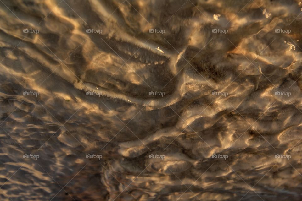 Water flowing over calcium deposits