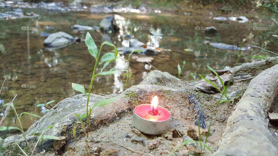 candle by the creek