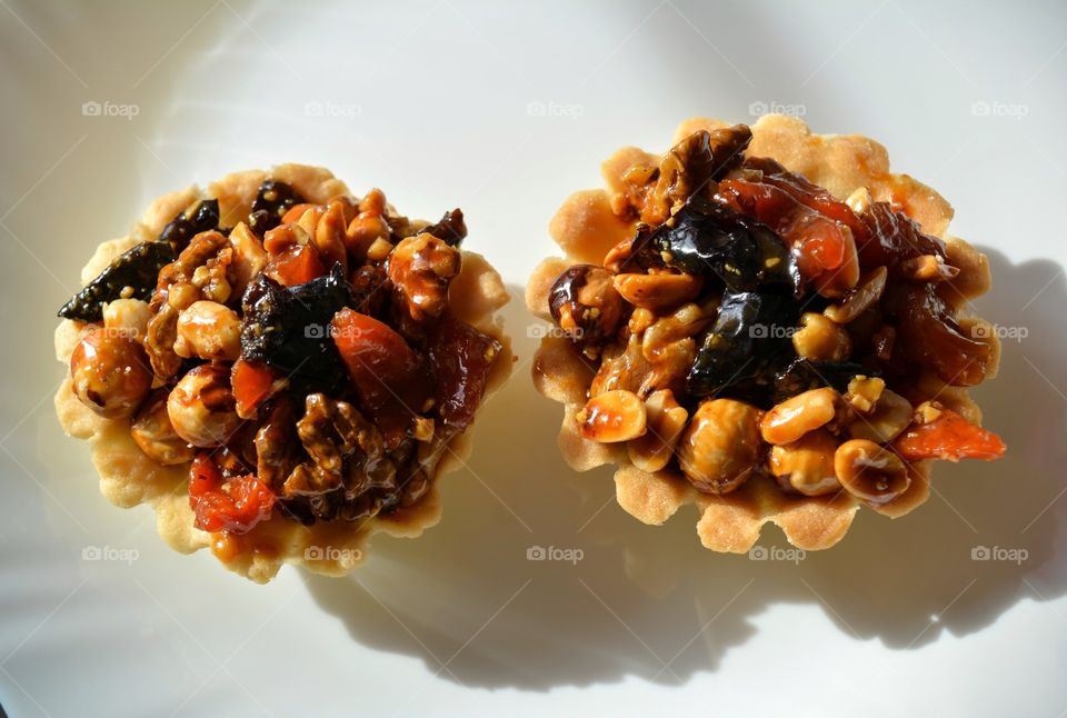 cakes with nuts on a white background top view