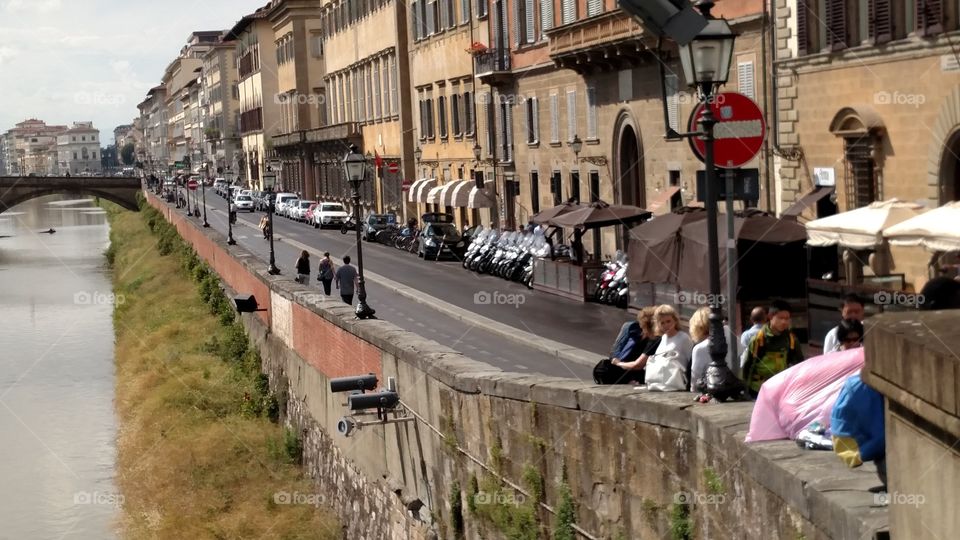 The street next to the Arno river in Florence, Italy- Lungarno degli Acciaiuoli.