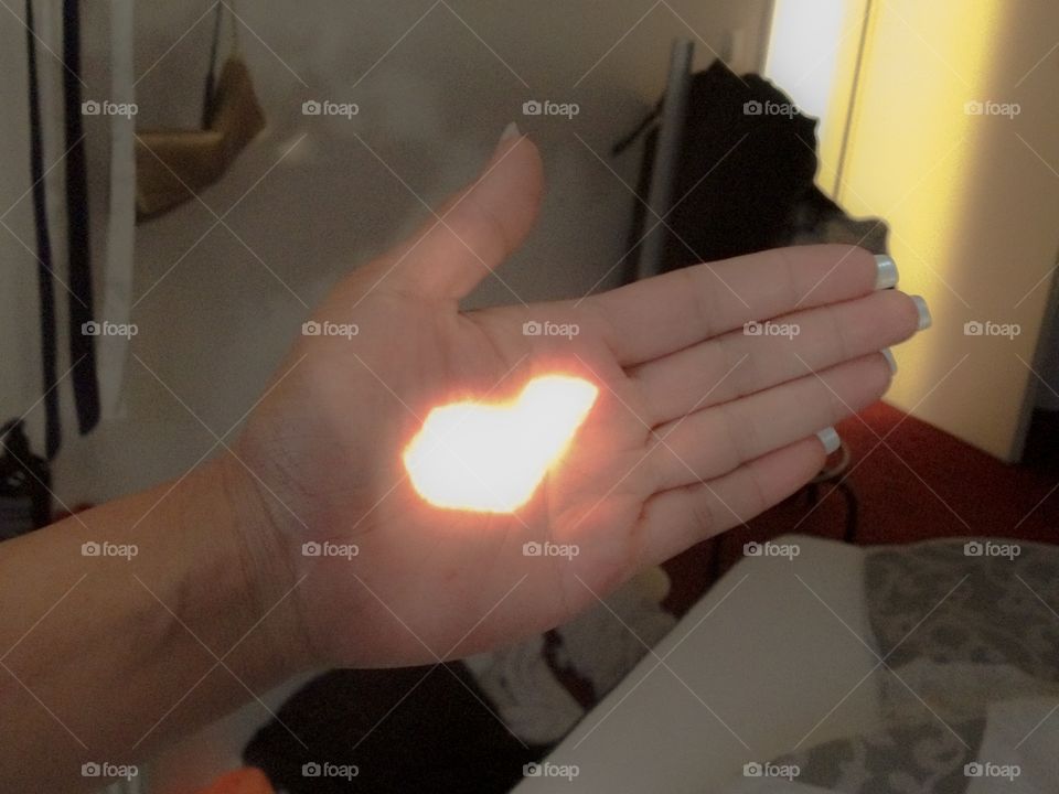 Captured a heart shaped light on my hand