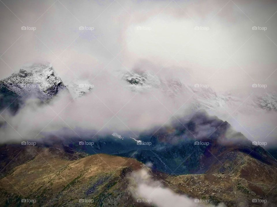 Clouds flying by mountain 