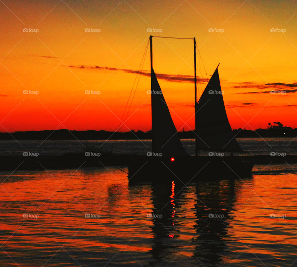 The habor had turned brilliant orange and the sky was streaked with the most beautiful sunset I had seen! Amber and tangerine beams were thrown into the dusty sky, its beautiful colors embracing the heavens gracefully!