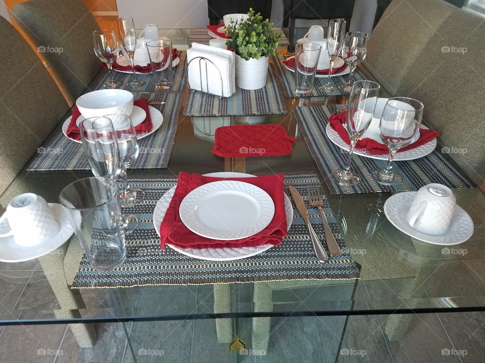 Place setting on glass dinning Table