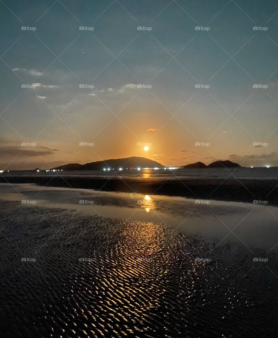 two moons, reflection of the sea