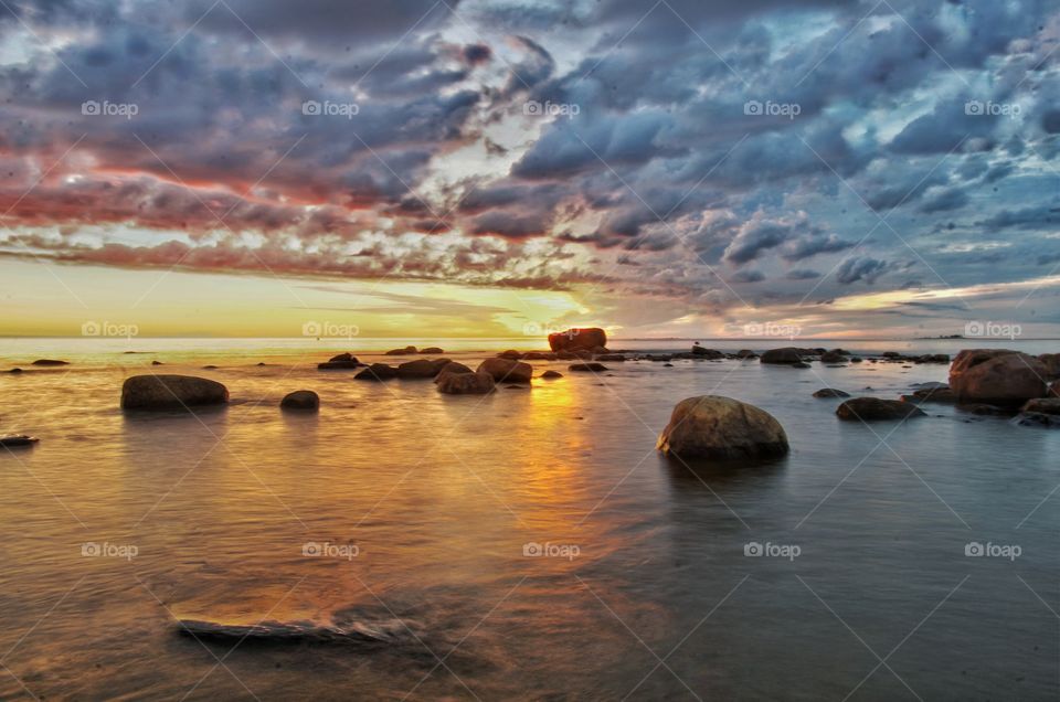 Scenic view of sea against dramatic sky