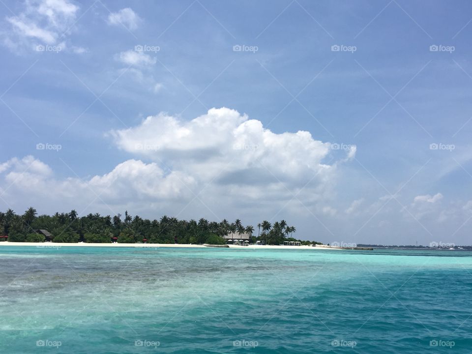 Beautiful water in Maldives. Private Island shot from boat