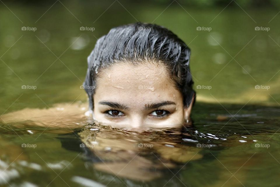 Eyes of a woman in the river