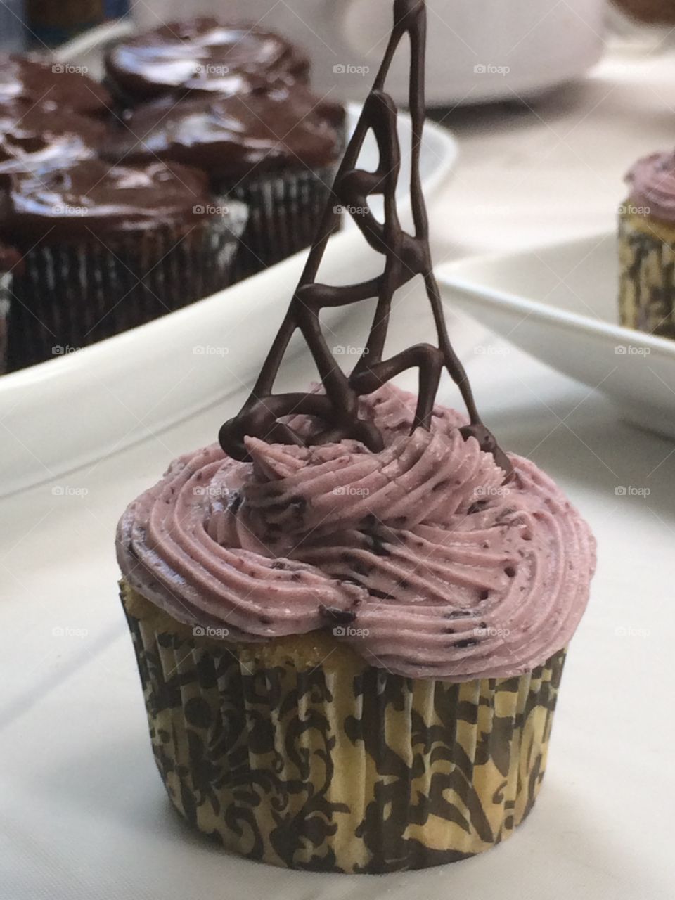 Ripe blueberry cupcake with chocolate Eiffel Tower 