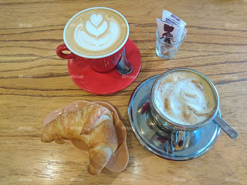 Morning breakfast afternoon brunch eat and drink coffee cappuccino latte macchiato and croissant in wood table, tasty delicious food
