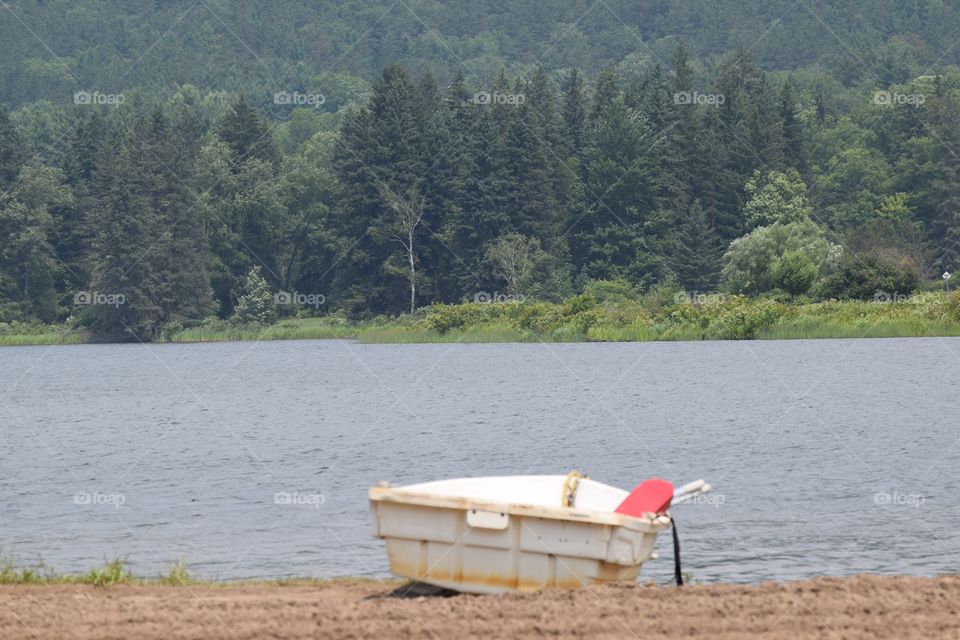 Boat moored at idyllic lake