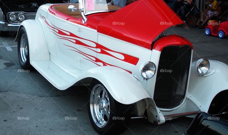 red and white flame design roadster at classic car show in California