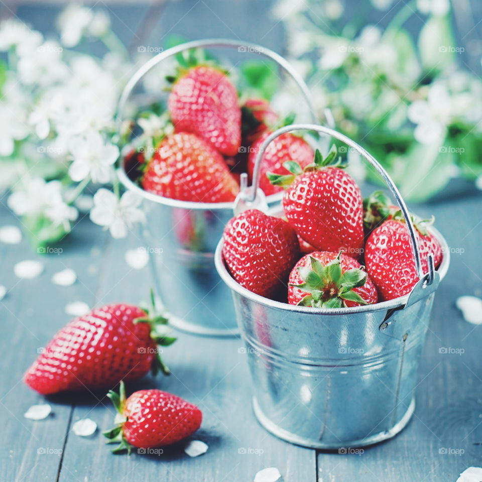 Small buckets of strawberries