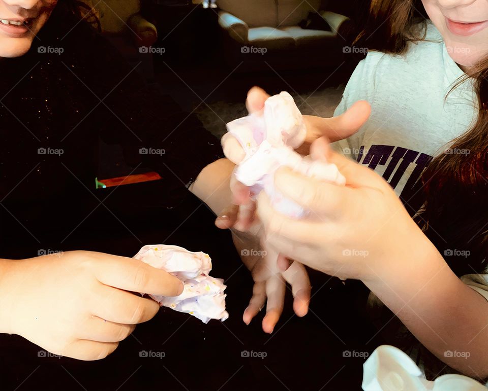 Glimmers Moment Of Happiness High Angle Of Children Sisters  Playing With Textured Pink Slime At The Table And Playing Around With Each Other.