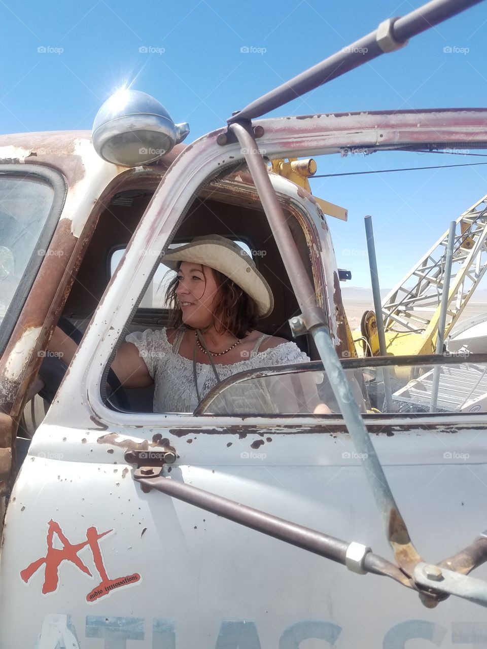 cow girl in old truck