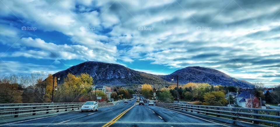 Bridge to autumn mountains