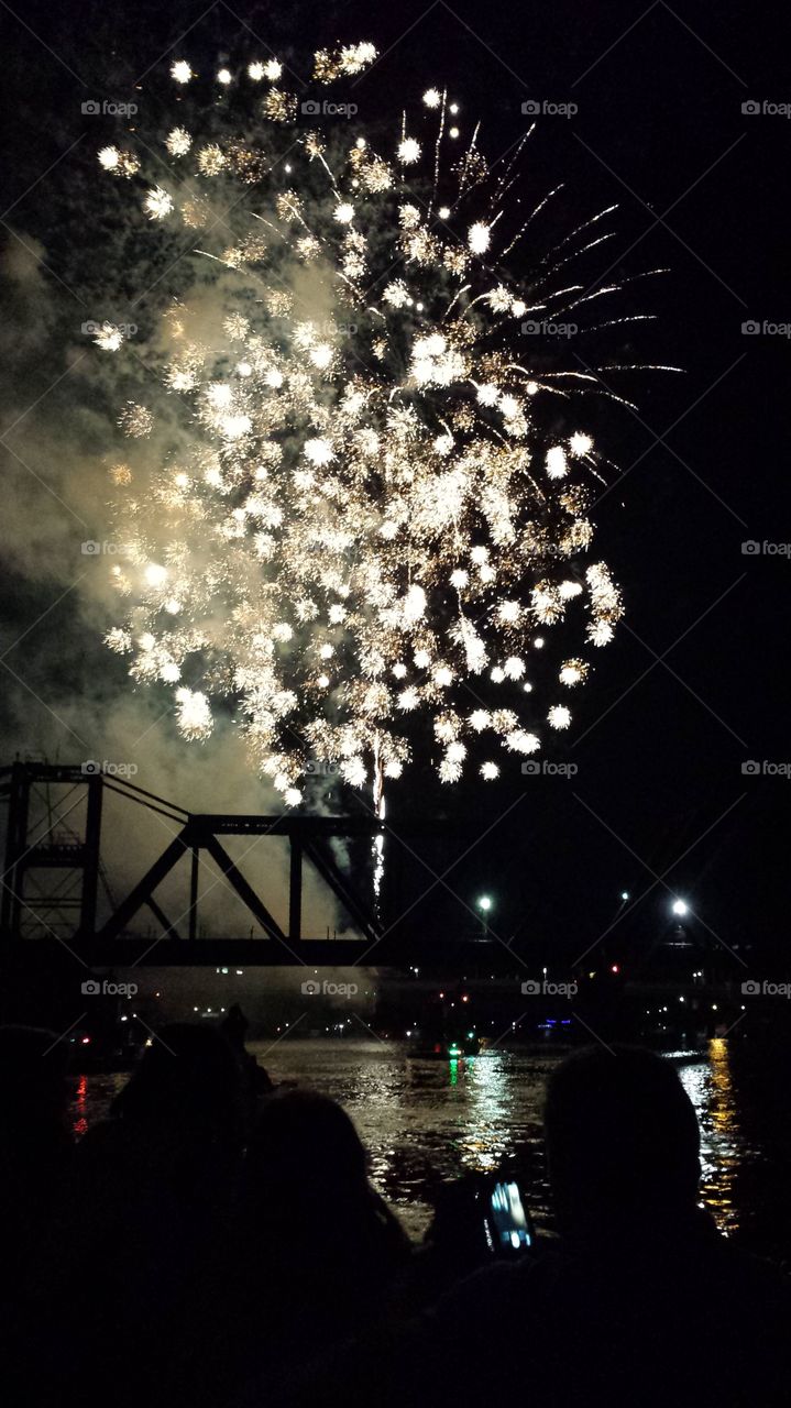Stars on the water. On a boat beneath old bridge in louisiana on the 4th of July 2015