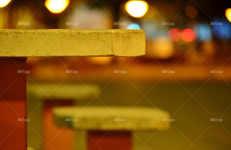 Bench in street at night