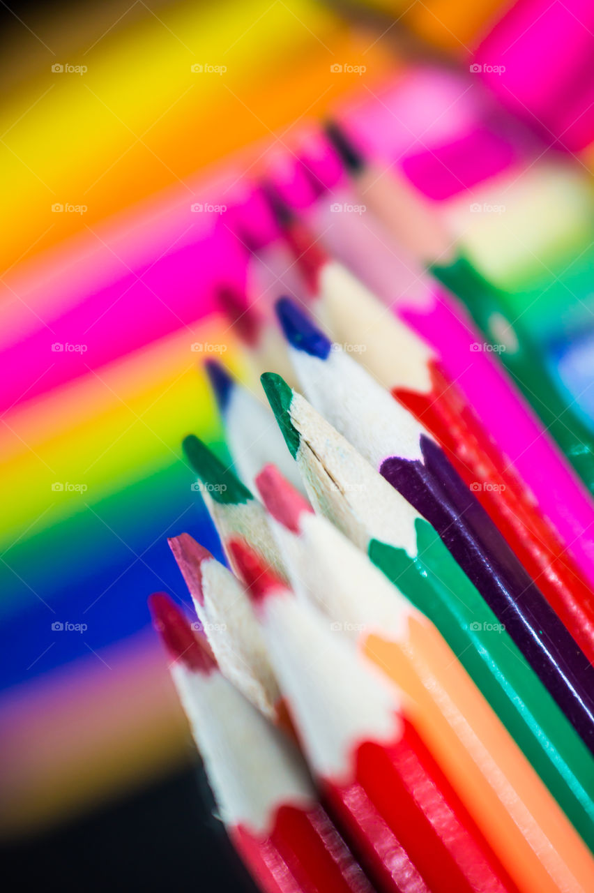 colored pencils lie on the mirror