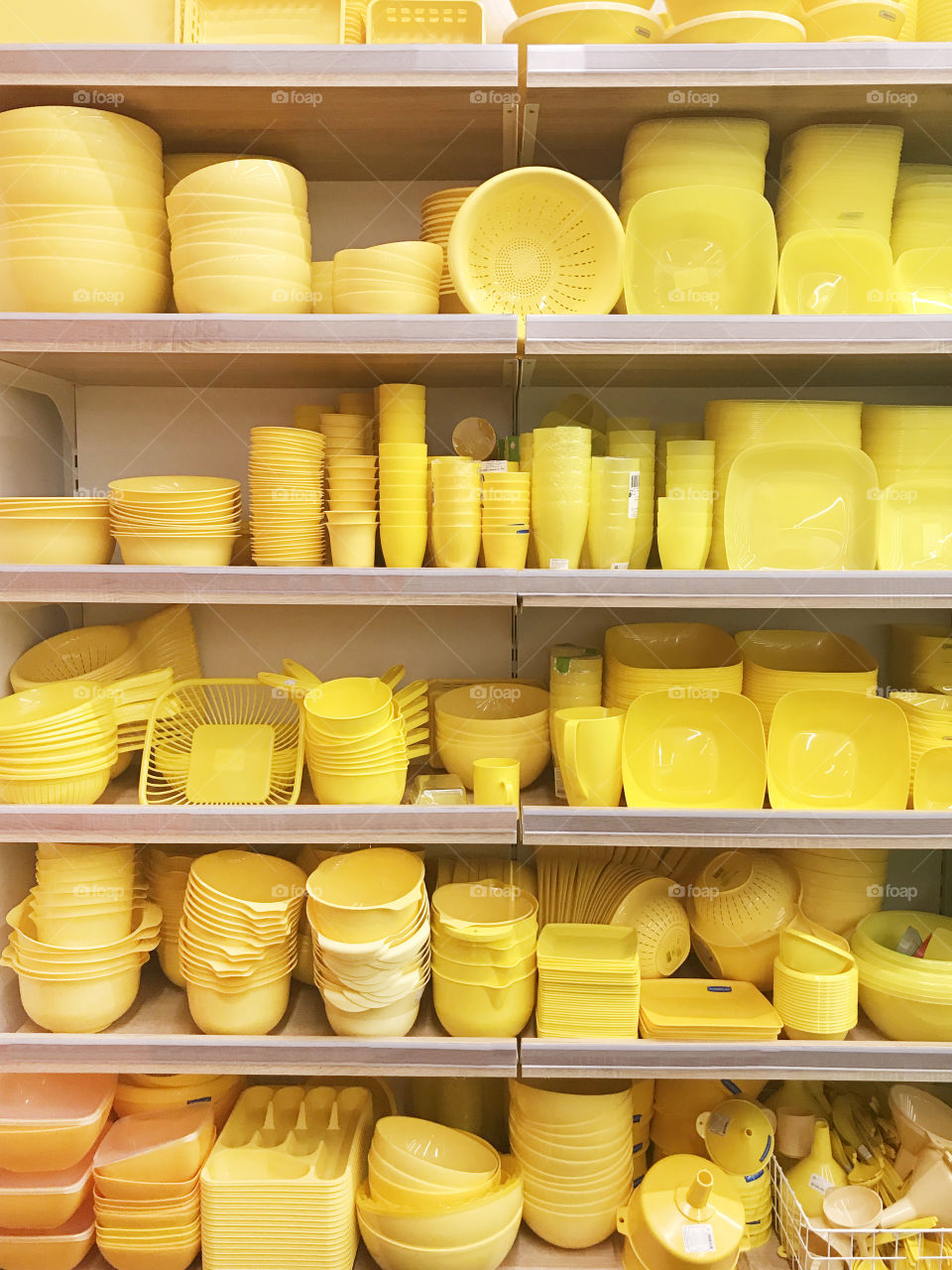 Beautiful yellow dishes on a shelves