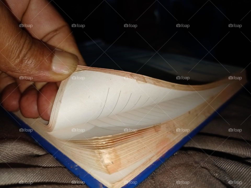 man flipping pages of old diary book sweet memories it's looking nice