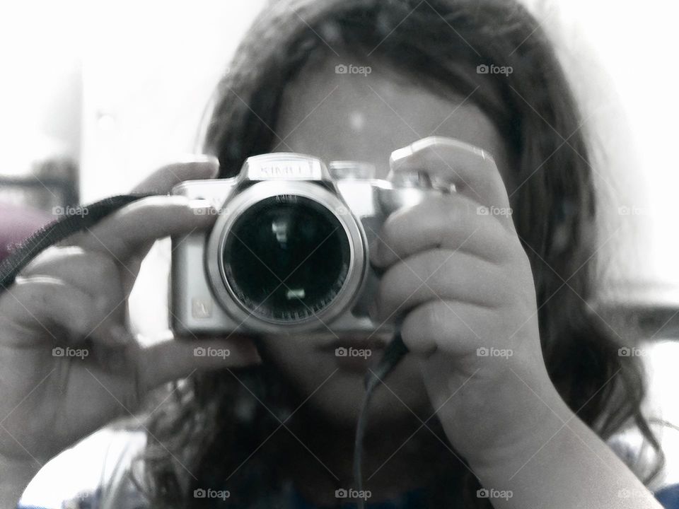 Our Daughter Taking A Photography With The Camera Reflection In The Mirror Close-Up.