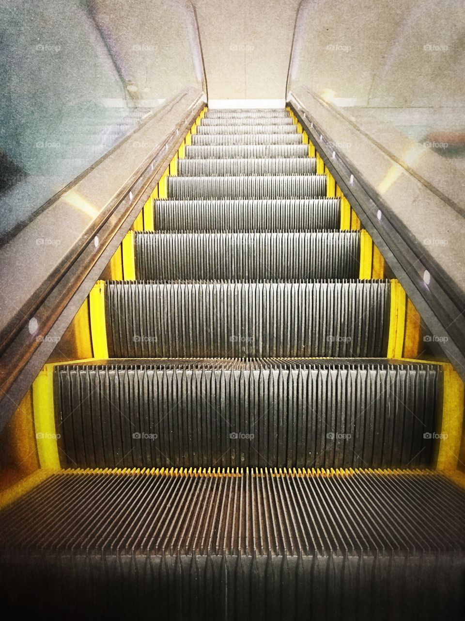 Looking up at an escalator 
