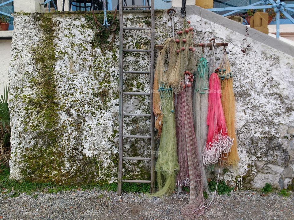 Fishing net hanging on wall
