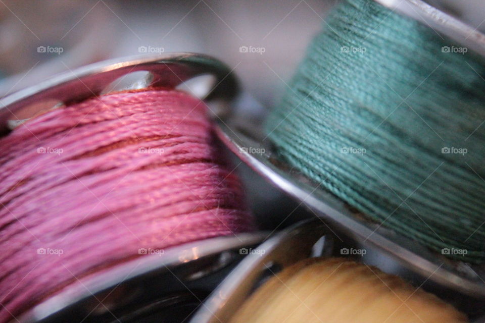 Pink, turquoise and yellow spools