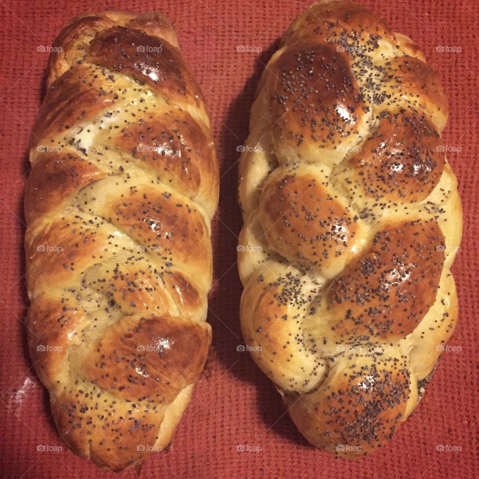 Two loaves of perfectly baked and braided challah