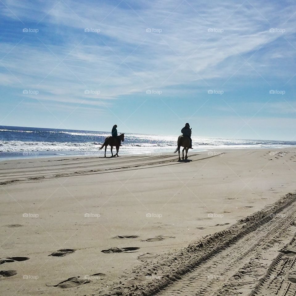 Horseback on an almost empty OBX beach.