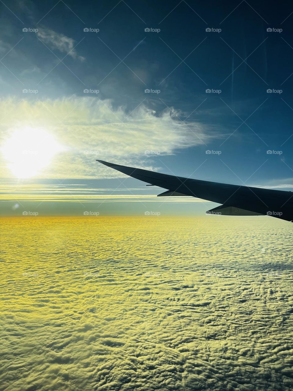 scenary from plane window showing sunrise and clouds - Best photo of month