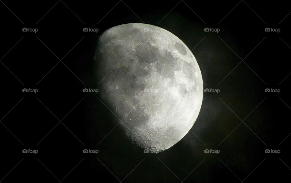 Close-Up Of The Moon On Waxing Gibbous Phase At Night With Details After Starting The First Quarter Four Days Ago.