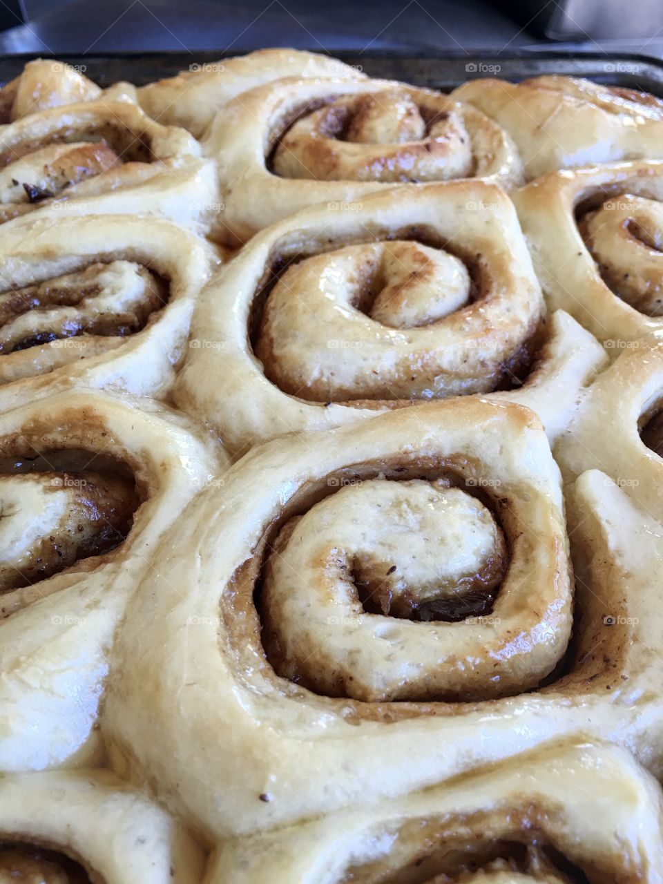 Home baked maple syrup glazed cinnamon rolls scrolls