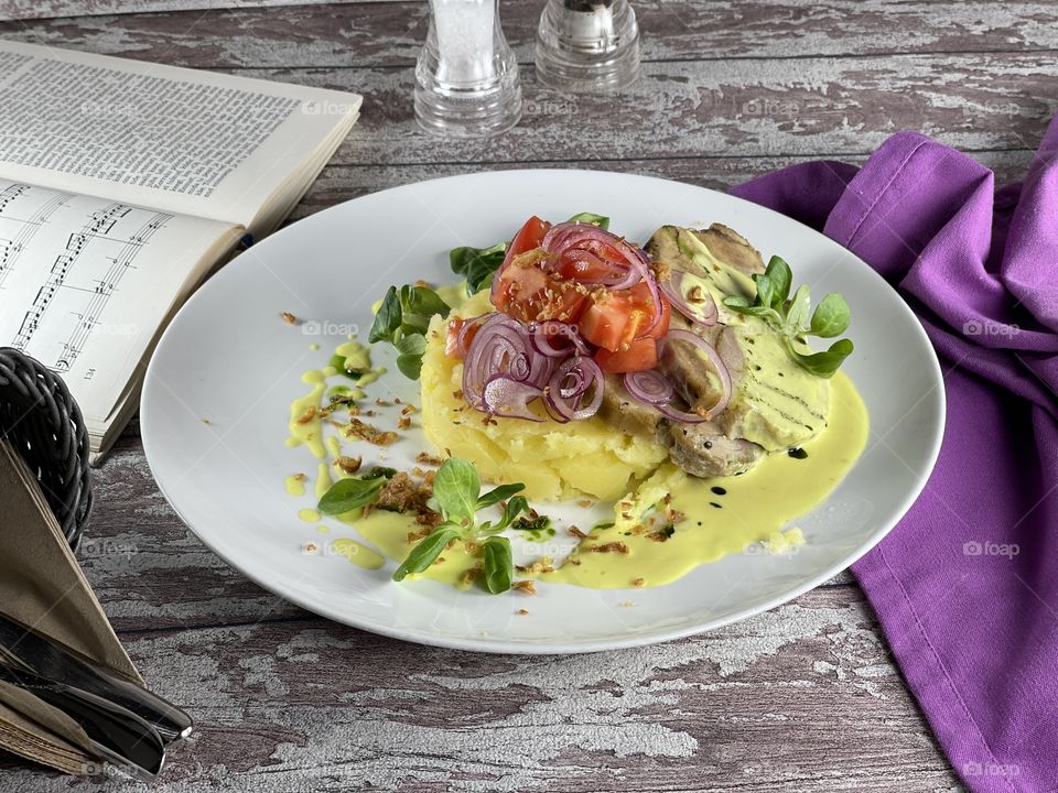 Oven baked pork with mashed potatoes and mustard sauce