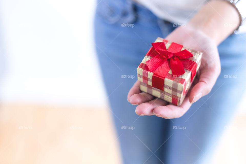 A lady holding a gift 