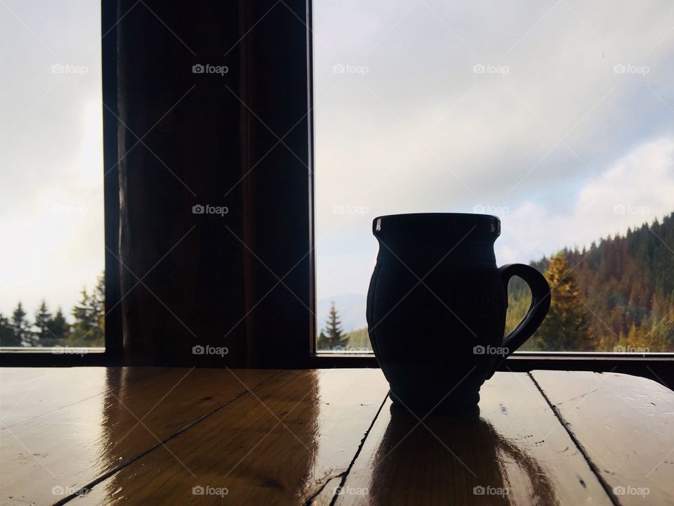 Silhouette of a mug near a window 