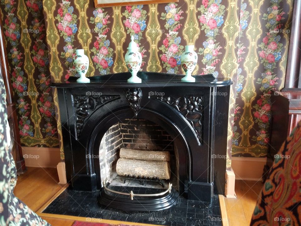 Oakland's: original cast iron fireplace