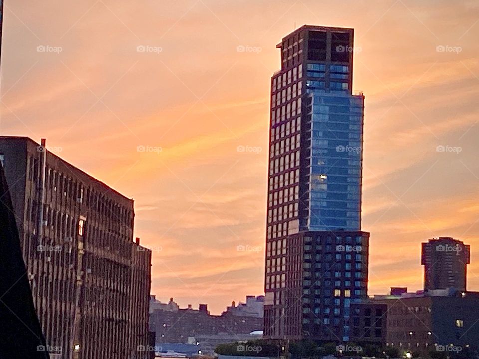 A fiery impression during the golden hour of sunset by the train tracks right off “Borden Ave” in Long Island City, Queens by the “Pulaski Bridge” during the summer months of 2022. Hypnotic Productions