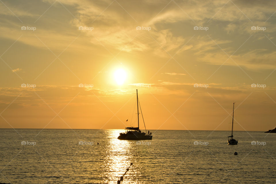 Silhouette of boat in idyllic sea