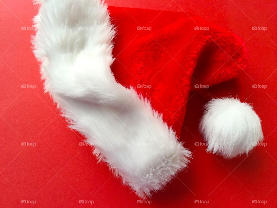 Santa Claus hat on red background