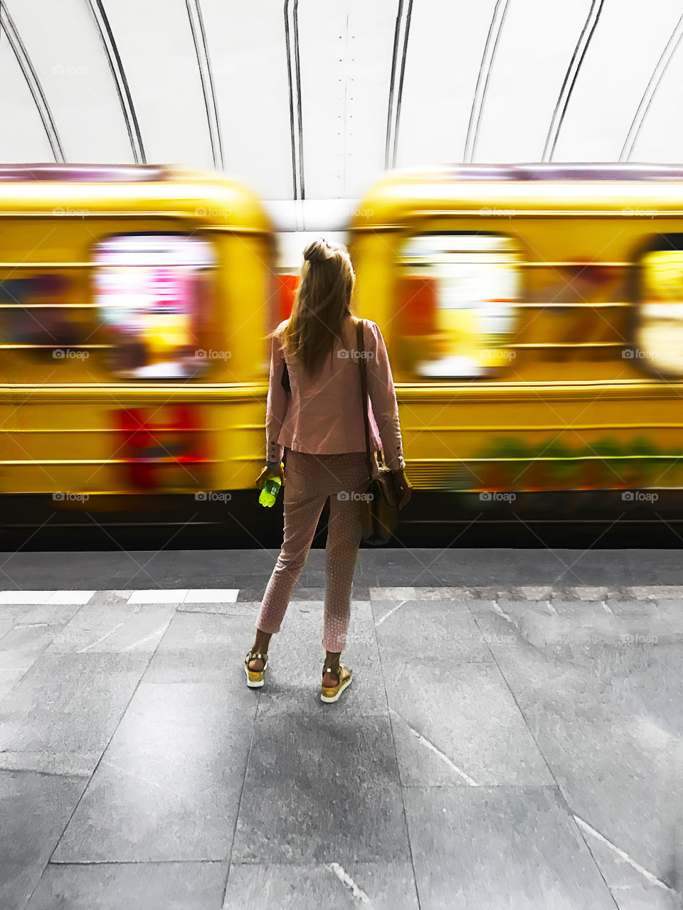 Young woman waiting for a train 