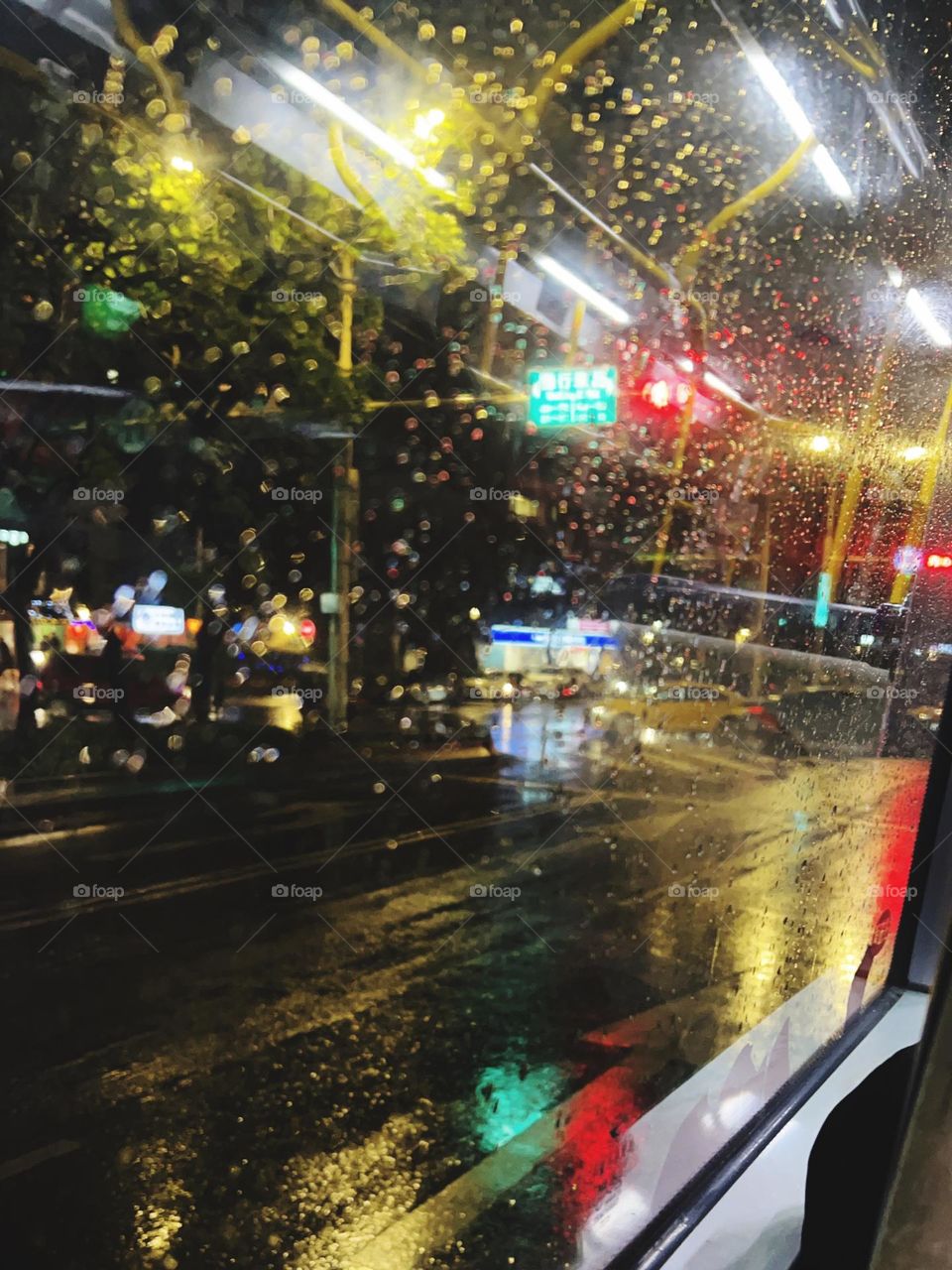 Traveling the city in the rain by bus