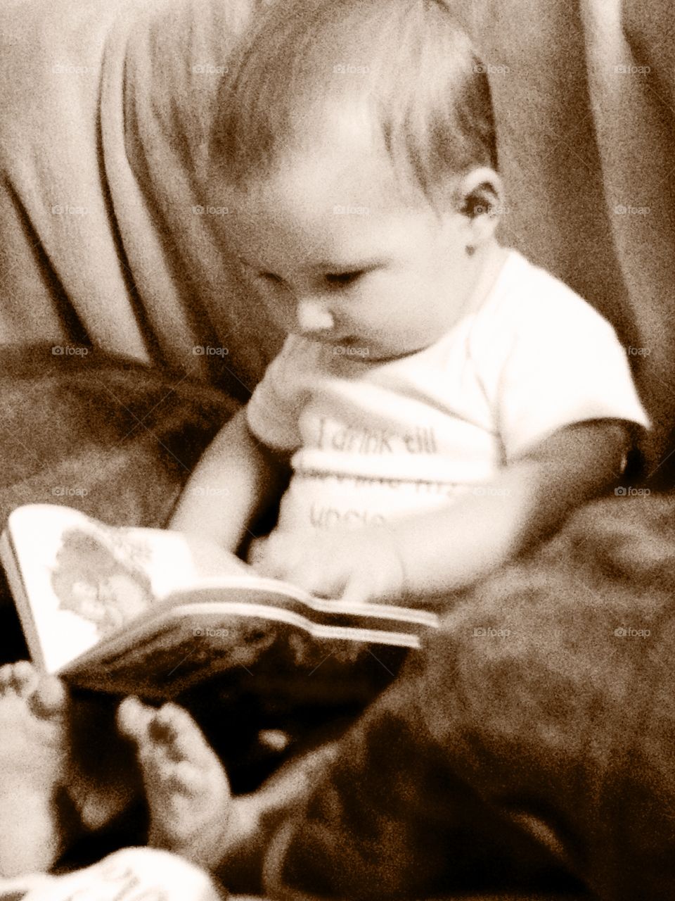 Little boy reading story book