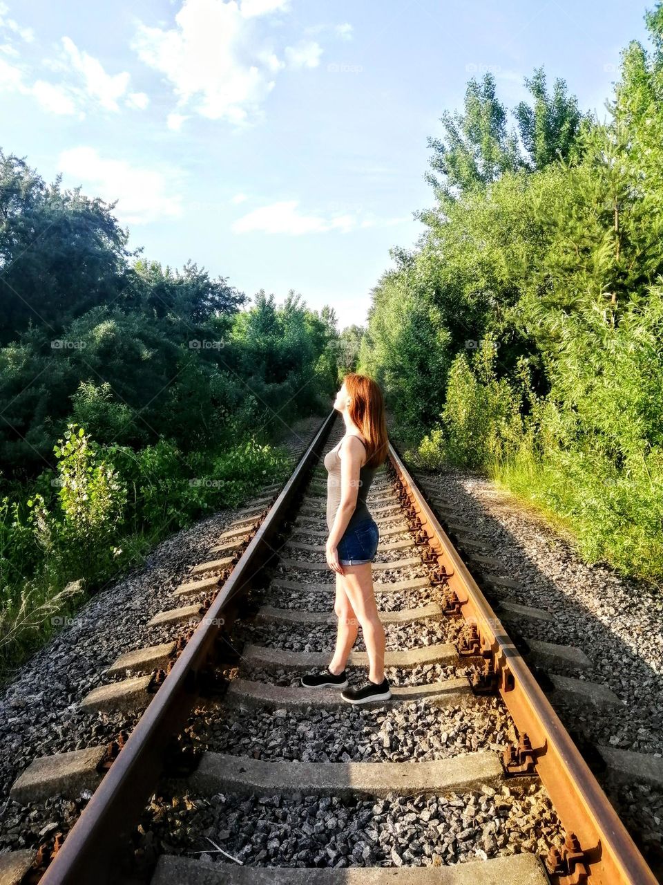 Sunlights kiss her at the railway