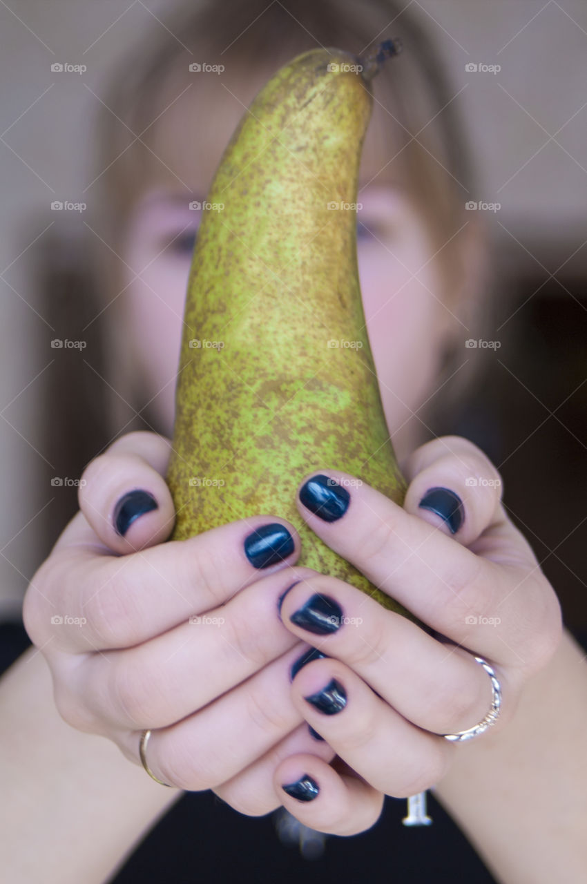 Girl holding fruits and vegetables