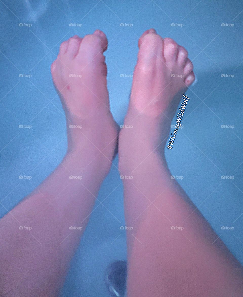 Toes curling up and stretching, enjoying the free feeling of not being in shoes. Relaxing the warmth of the sun and the water in a hot tub.