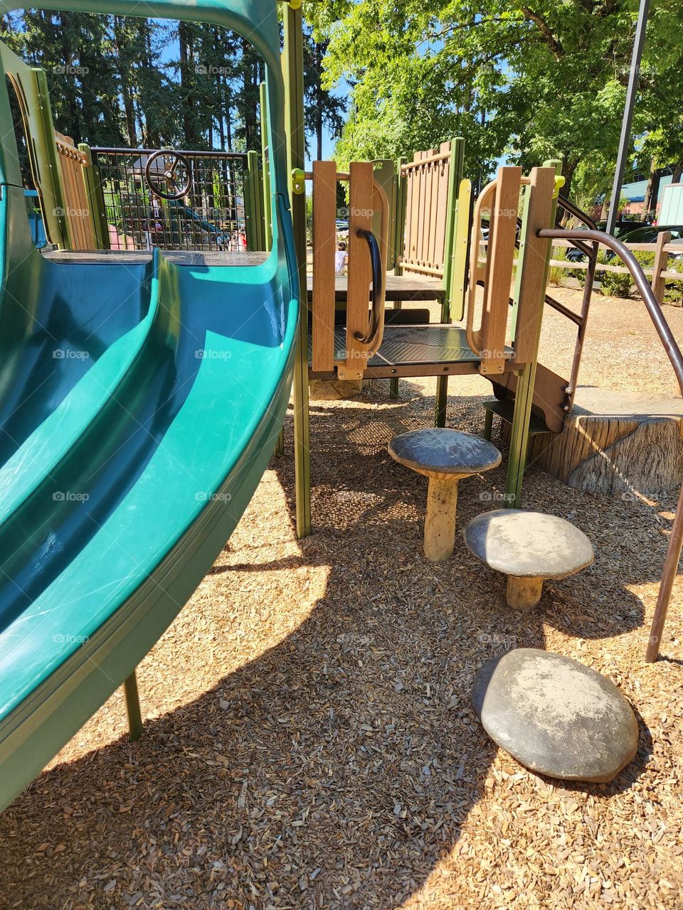 inviting happy playground equipment for children in an Oregon park on a bright Summer weekend