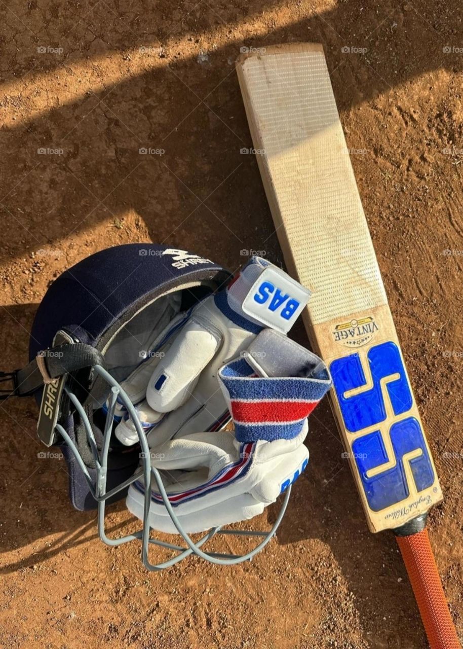Cricket is being practiced in a local ground.